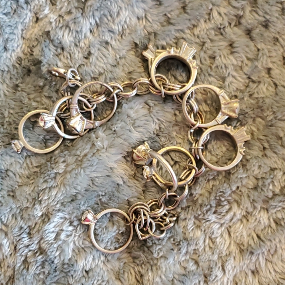 Charm bracelet with 10 "engagement rings".